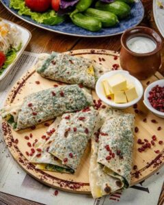 Stuffed flatbreads with garnishes and sides - Qutab in Azerbaijan food