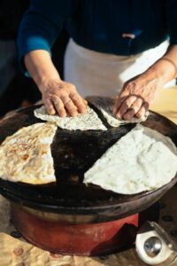 Hands preparing traditional Azerbaijani flatbread Qutab